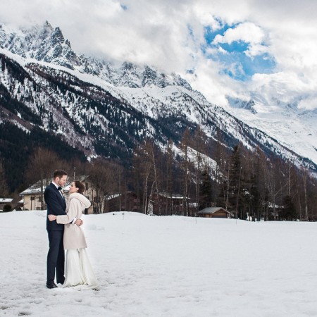 cozy hamlet wedding couple snowy mountain fur lined bridal shaw